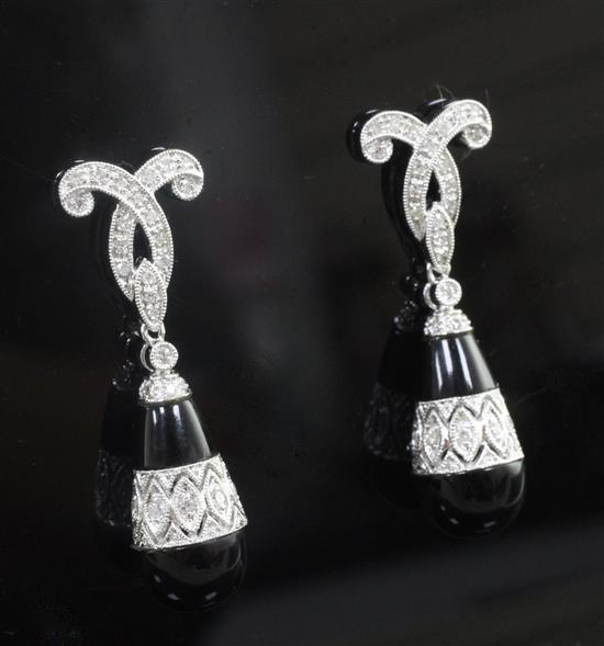 A modern pair of 1920s style 14ct white gold, black onyx and diamond set pear shaped drop earrings, 35mm.